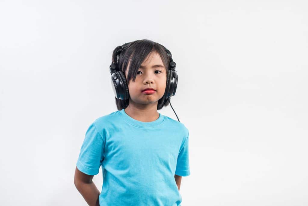 Little girl listening to music
