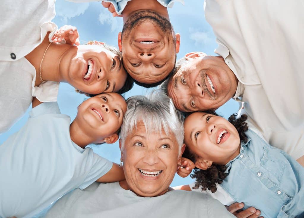 Shot of a multi-generational family standing together in a huddle